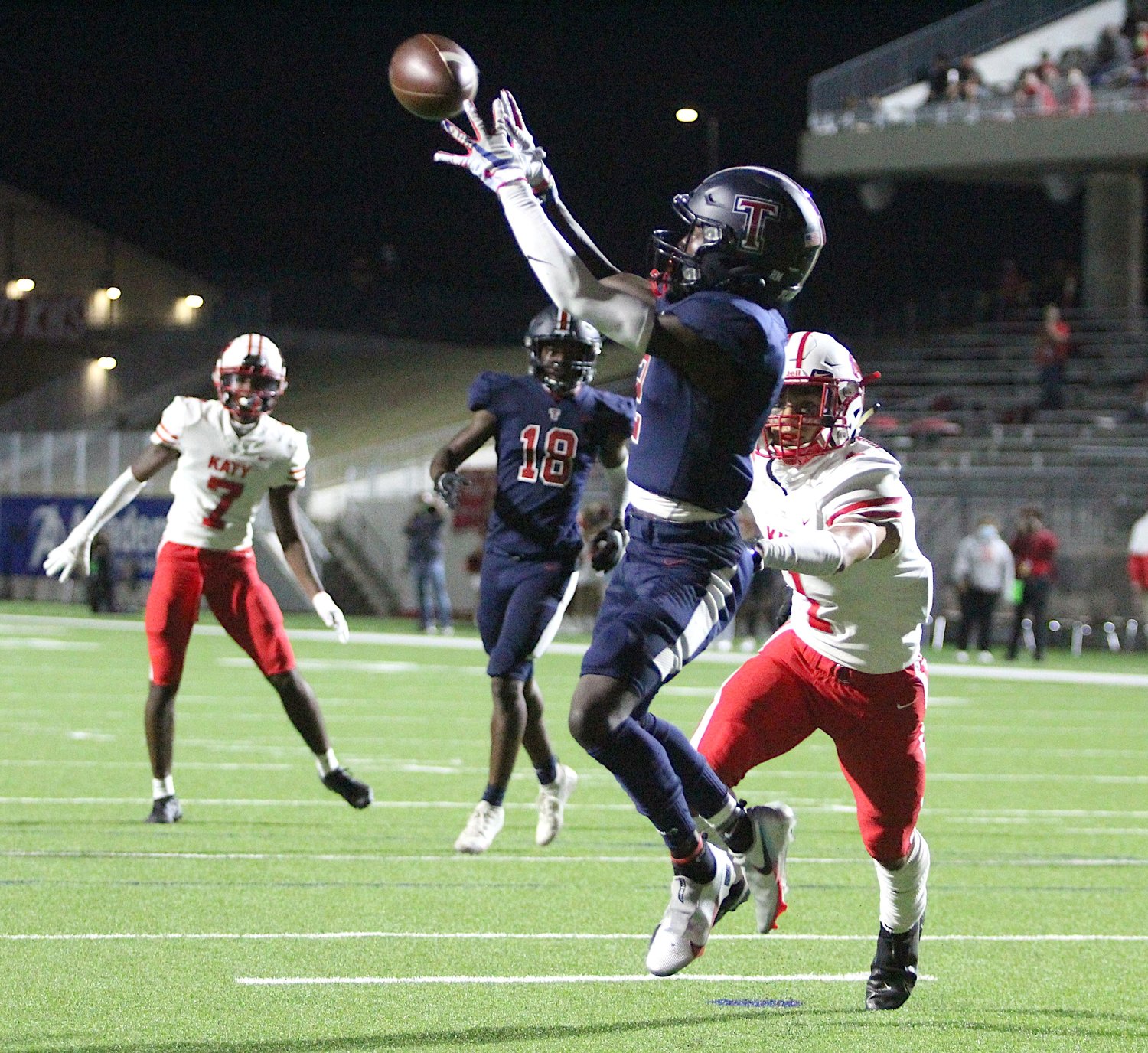Tompkins junior receiver Joshua McMillan II leaps to haul in his first touchdown of the game during the Falcons' 24-19 win over Katy on Thursday evening at Legacy Stadium.